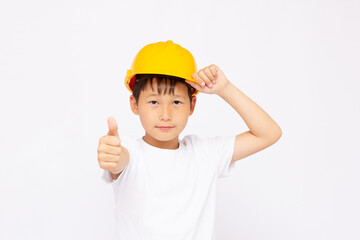 Cute kid while wearing construction helmet, isolated on white background