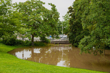 Fototapeta na wymiar Maastricht, Netherlands 07-15-2021 floods in downtown Maastricht and the historical centre after heavy rainfall with over 150mm of rain in less than 24 hours and a flooded city park due to high water