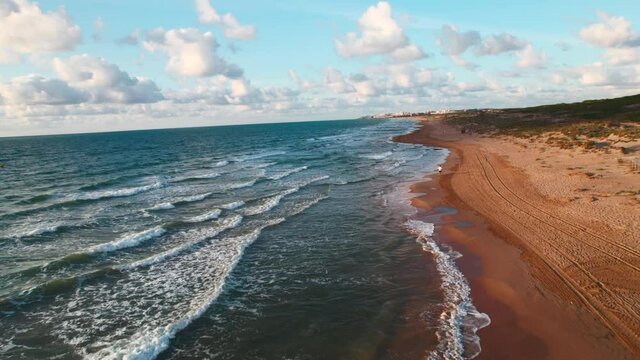 Aerial panoramic view of empty sandy beach of La Mata in the early morning. First person view motion. Costa Blanca. Province of Alicante. Torrevieja. Spain. Travel concept