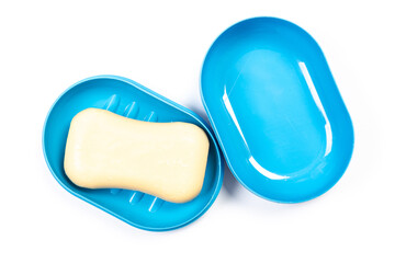 Travel soap in plastic soap dish isolated on white background