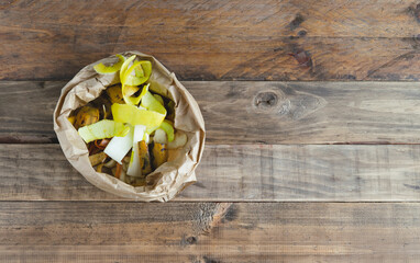 Bag with fruit peels for composting. Copy space.