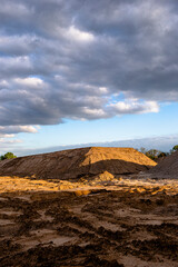 artificial dune made of piled building sand on a construction site in cologne, germany looks like a desert