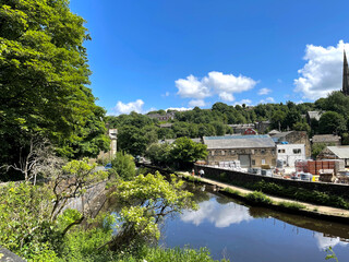 Fototapeta na wymiar View over the, Rochdale Canal, with buildings and trees, near the centre of, Todmorden, Yorkshire, 
