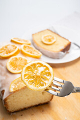 caramelized lemon slice on a lemon cake decorated with caramelized lemon slices