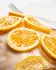 Fototapeta na wymiar caramelized lemon wedge over a lemon cakes
