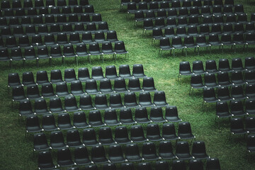 Closeup shot of empty chairs on a field