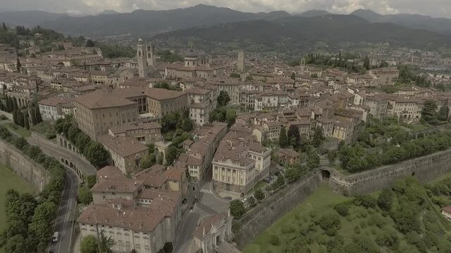 Aerial drone footage view of Bergamo, historical buildings and towers  of Old city, in Italy // no video editing

