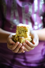 hands of a person holding a salad