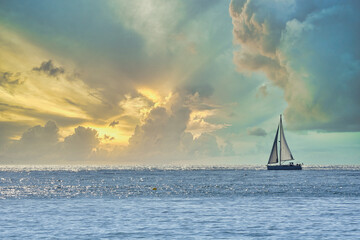 Sailboat sailing in the Mediterranean Sea in a beautiful sunset