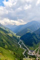 Fototapeta premium view of the mountain gorge with the river and the road