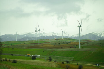 Fototapeta Electricity Wind turbine landscape. Wind farm energy eco friendly in mountains. Renewable clean energy production obraz