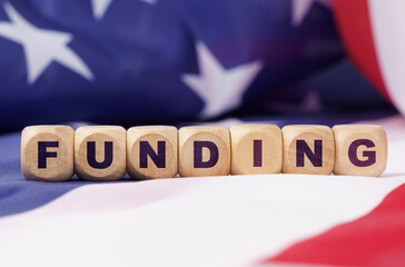 The US flag has cubes with the inscription - FUNDING