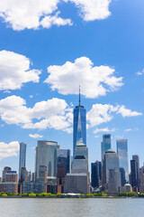 Unique shape clouds float over the Lower Manhattan skyscraper in springtime at New York City NY USA...