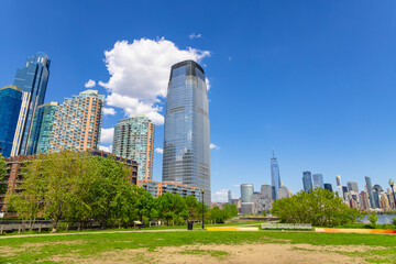 Unique shape clouds float over the Luxury high-rise apartments in Jersey City New Jersey ward and Lower Manhattan skyscraper in Manhattan ward in springtime at New York City NY USA on May 14 2021.  © STUDIO BONOBO