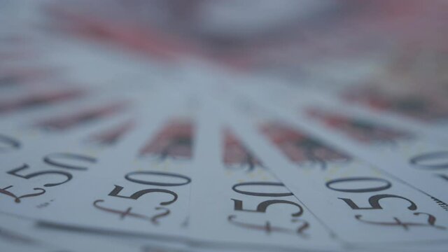 A close up view of 50 pounds notes.