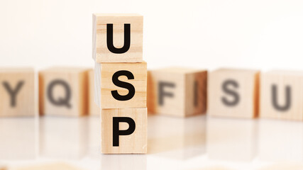 word USP from wooden blocks with letters, concept