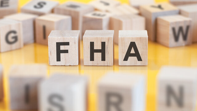 word FHA written on wood blocks, concept.