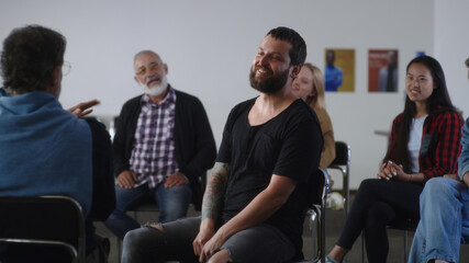 Diverse people supporting happy reformed addict