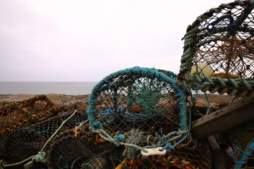 A lobster trap or lobster pot is a portable trap that traps lobsters or crayfish.In Scotland in the north,the word creel  is used to refer to a device used to catch lobsters and other crustaceans. 