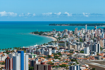 Fototapeta na wymiar Joao Pessoa, Paraíba, Brazil on March 10, 2010. Partial view of the city showing buildings, the sea and the tip of Cabo Branco.