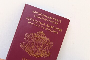 Holding Bulgarian and Russian passports in the hand. Ready for vacation or immigration concept