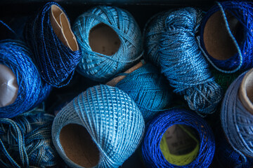 Many balls of yarn, blues.