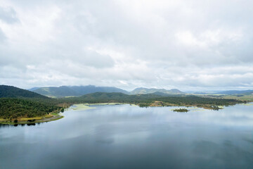 Fototapeta na wymiar Calm Water And Cloud Reflections On Dam