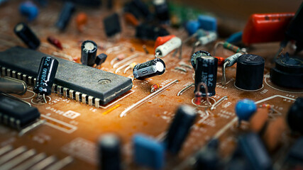 Old broken brown microcircuit close-up, old technology