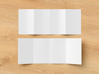 Vertical double gate fold brochure. Four panels, eight pages blank leaflet. Mock up on wooden...