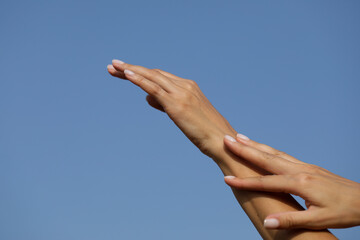 Fototapeta na wymiar hands on sky. Hands. Sensual woman. Finger. Gesture