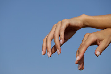 two hands in the sky