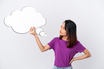 Young Vietnamese woman isolated on white background holding an empty speech bubble