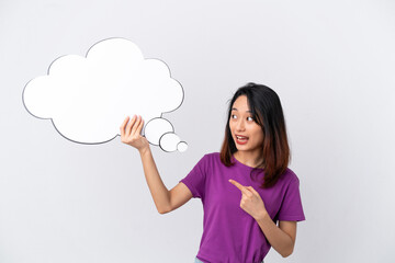Young Vietnamese woman isolated on white background holding a thinking speech bubble with surprised expression