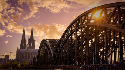 Famous Hohenzollern Bridge in Cologne leading to the Cathedral - COLOGNE, GERMANY - JUNE 25, 2021