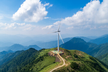 Aerial photography of wind power equipment on high mountains 