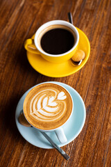 delicious coffee in beautiful cups, morning ritual, a human holds a cup of coffee. strong coffee filter and cappuccino