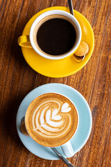 delicious coffee in beautiful cups, morning ritual, a human holds a cup of coffee. strong coffee filter and cappuccino