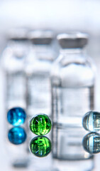 Set of transparent medical glass bottles of liquid with different color balls. Healthcare. concept...