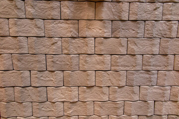 wall texture of stone blocks finely aligned horizontally in full frame