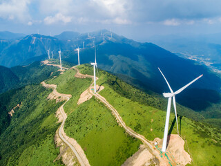 Aerial photography of wind power equipment on high mountains 