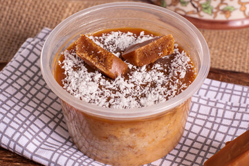 dulce de leche cake on wooden background