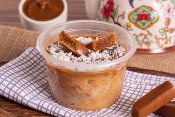 dulce de leche cake on wooden background
