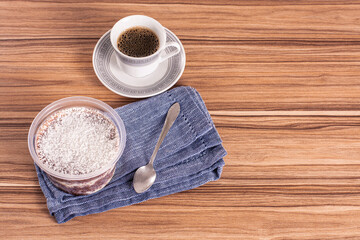 coconut and chocolate pot cake on wooden background