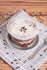 coconut and chocolate pot cake on wooden background