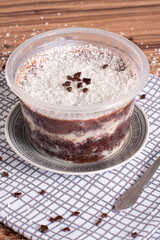 coconut and chocolate pot cake on wooden background