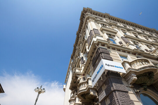 RIJEKA, CROATIA - JUNE 18, 2021: Agram Banka logo on their Rijeka office. Agram Banka, formerly kreditna banka zagreb,  is a Croatian retail and commercial bank from Zagreb...