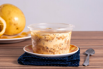 cake in maracuja pot on wooden background