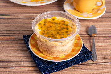 cake in maracuja pot on wooden background