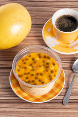 cake in maracuja pot on wooden background
