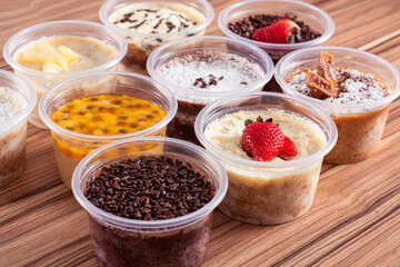 cakes in pot of various flavors on wooden background